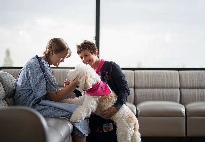 Medical Professional with patient and dog