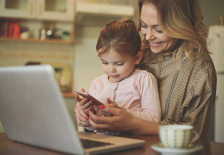 Mother and daughter on computer