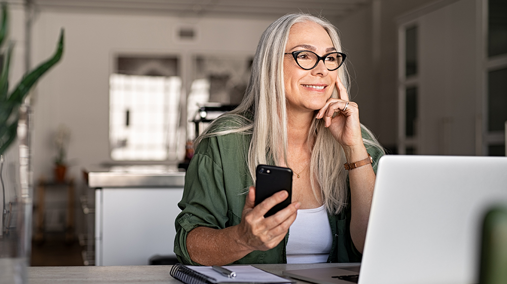 Woman making an appointment on her phone