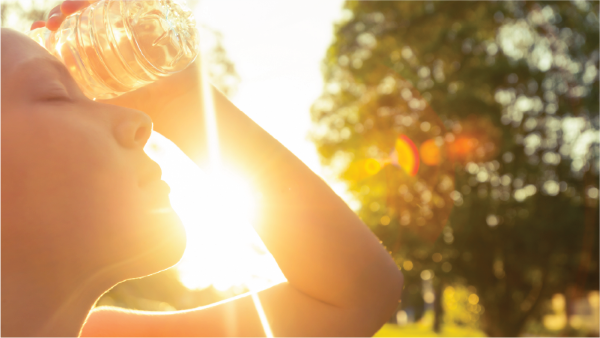 woman holding water bottle