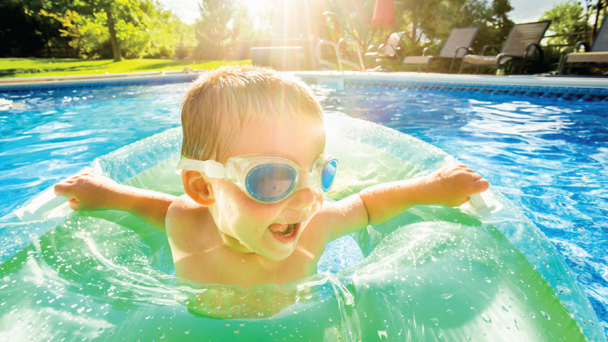boy swimming in pool