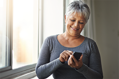 woman typing on cell phone
