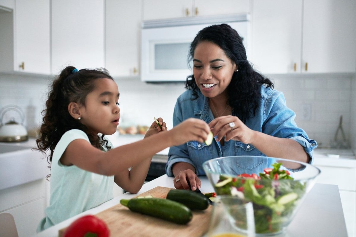 mother and daughter cooking