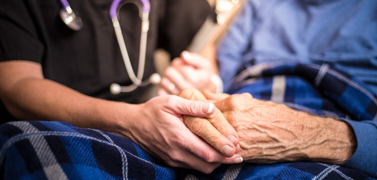 Hospice Care holding hands