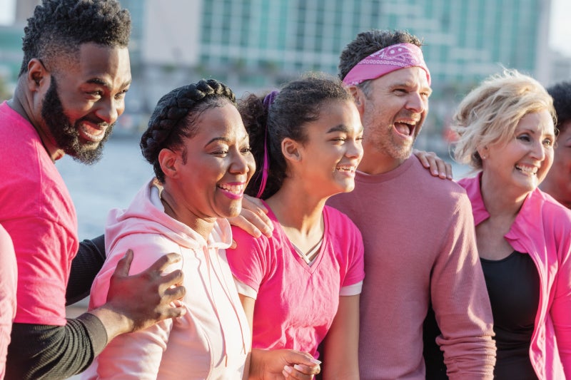 Men and women wearing pink for breast cancer awareness