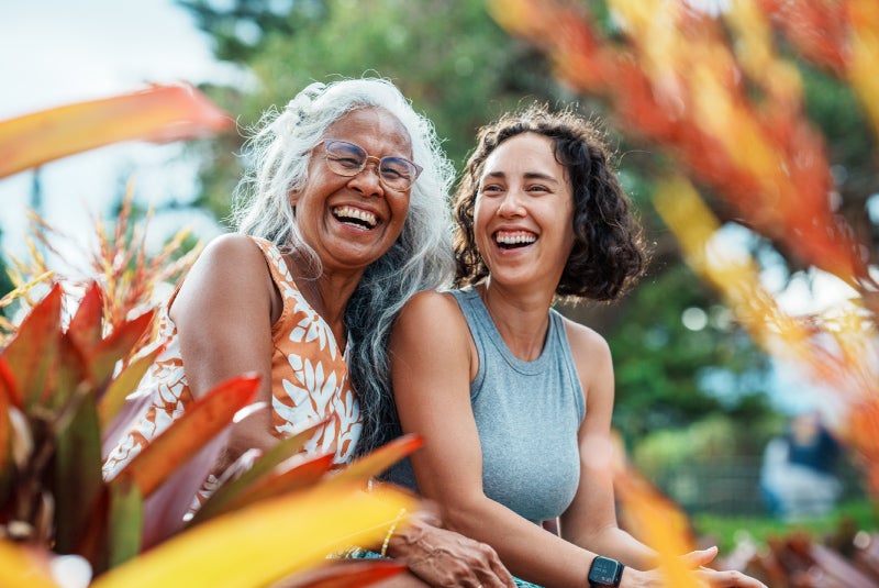 two women laugh