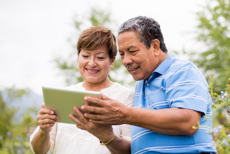 Couple looking at a tablet
