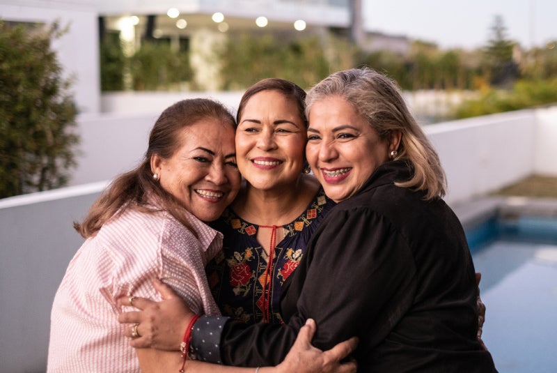 3 women hug
