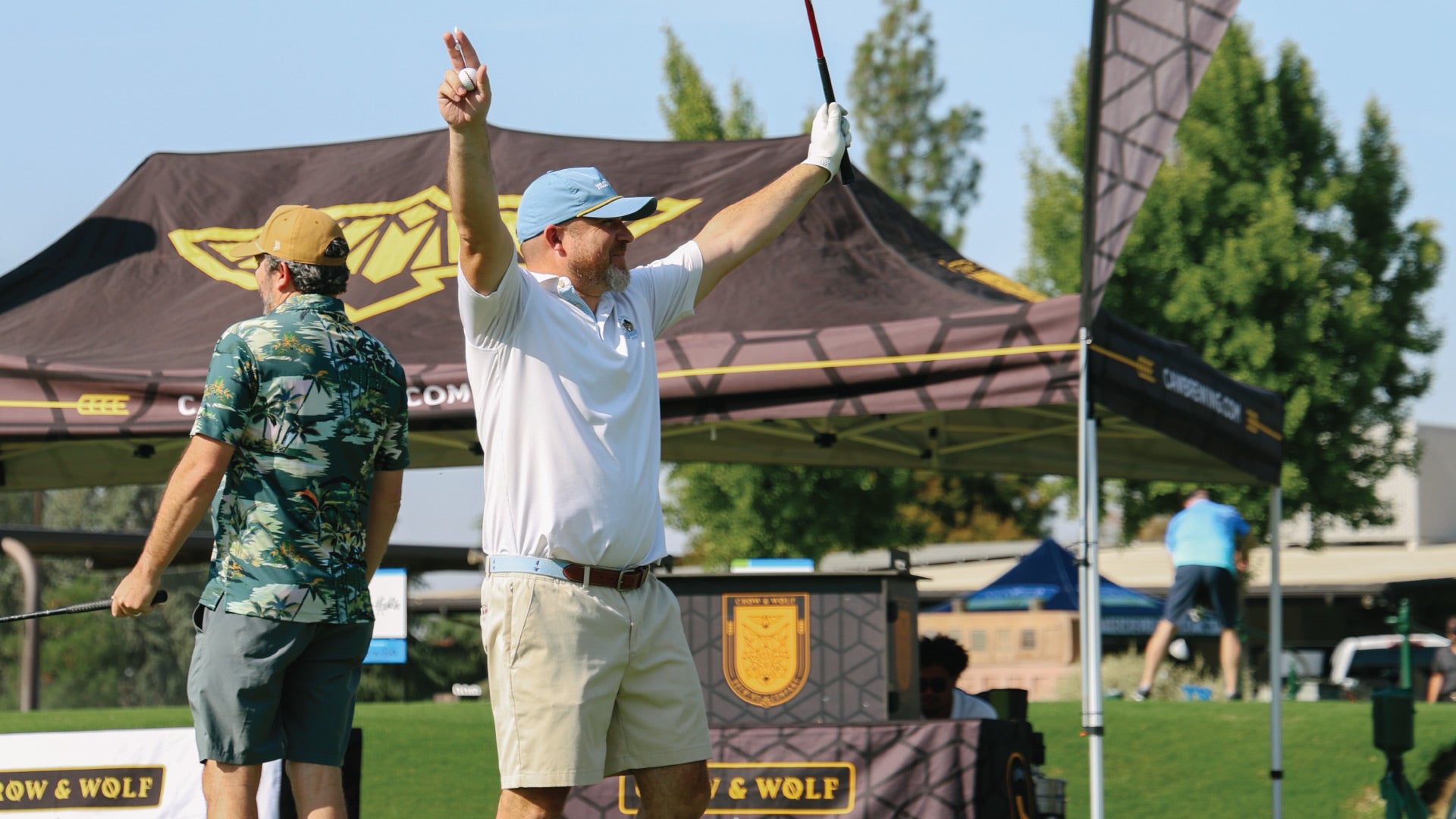 golfer with hands raised